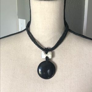 Black necklace with pearly accent piece